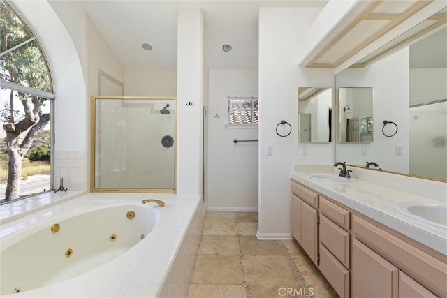 bathroom with plus walk in shower and vanity