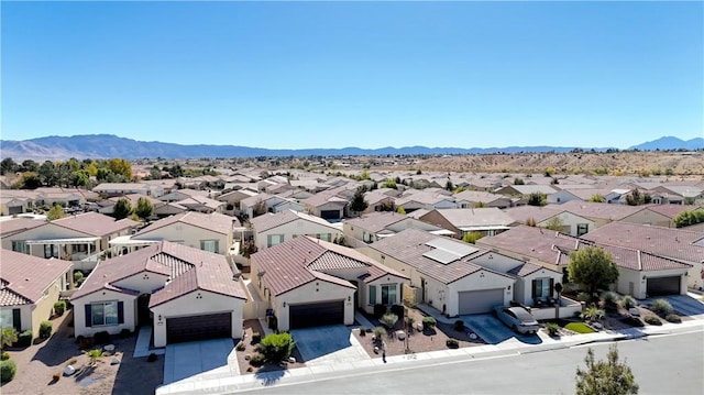 aerial view featuring a mountain view and a residential view