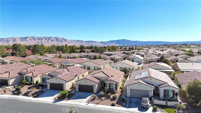 aerial view featuring a mountain view and a residential view