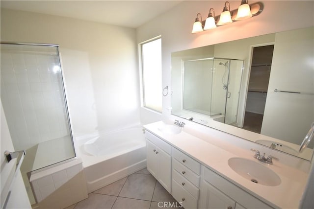 bathroom with shower with separate bathtub, vanity, and tile patterned floors