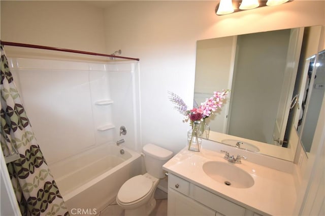 full bathroom featuring vanity, toilet, and shower / tub combo with curtain