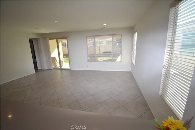 empty room with light tile patterned floors