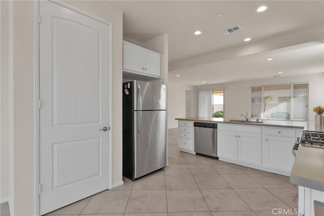 kitchen with visible vents, recessed lighting, appliances with stainless steel finishes, white cabinetry, and a sink