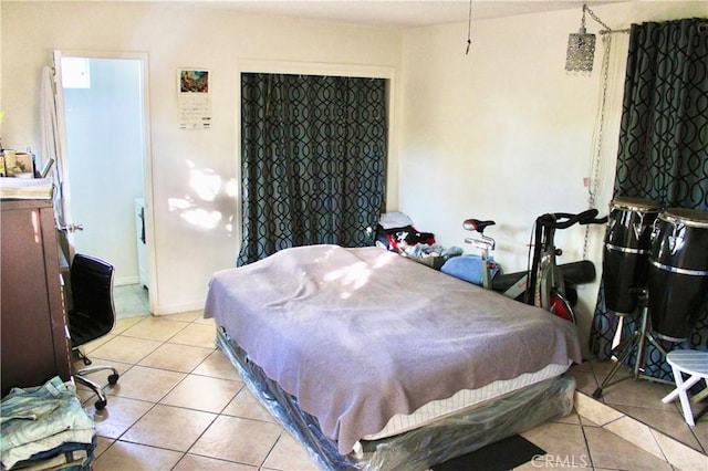 bedroom with light tile patterned floors