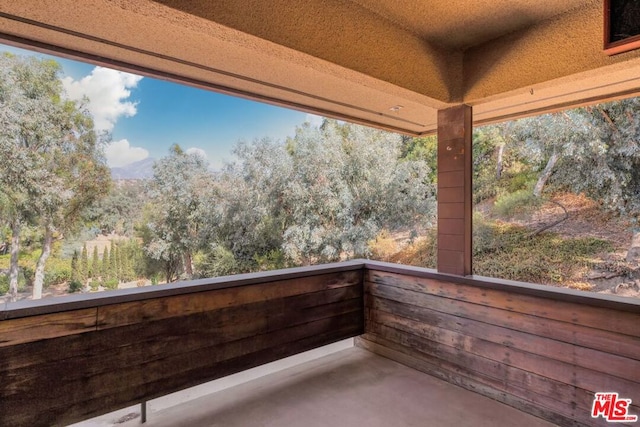 view of patio featuring a balcony