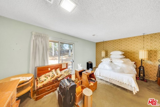 carpeted bedroom featuring a textured ceiling