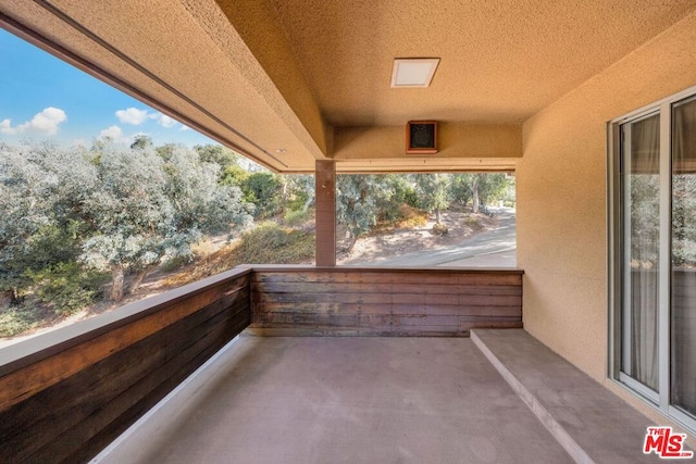 view of patio with a balcony