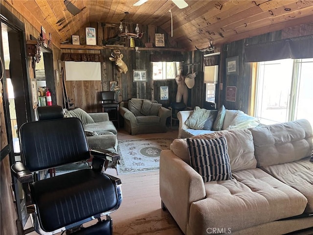 living room with wood walls, wood ceiling, and vaulted ceiling