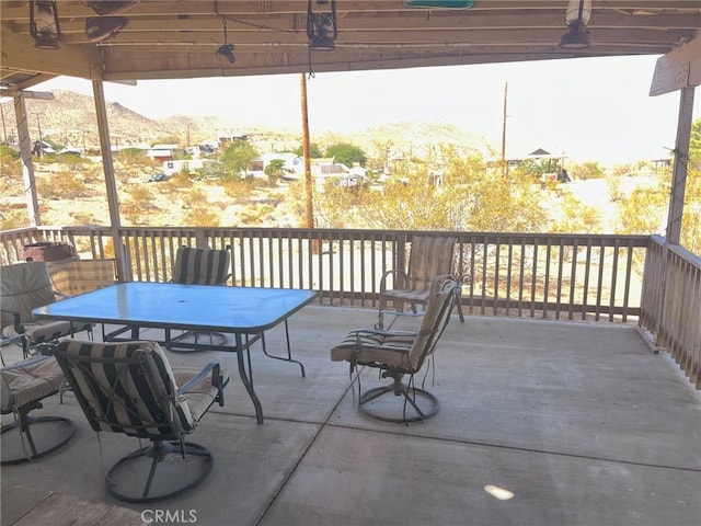 view of patio / terrace with a mountain view