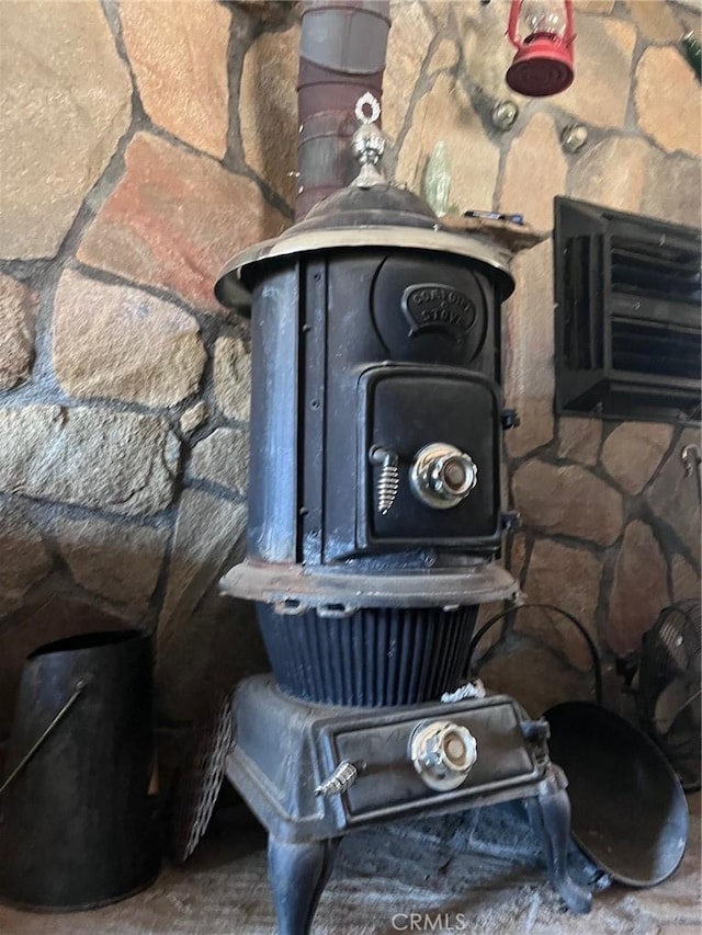 interior details featuring a wood stove