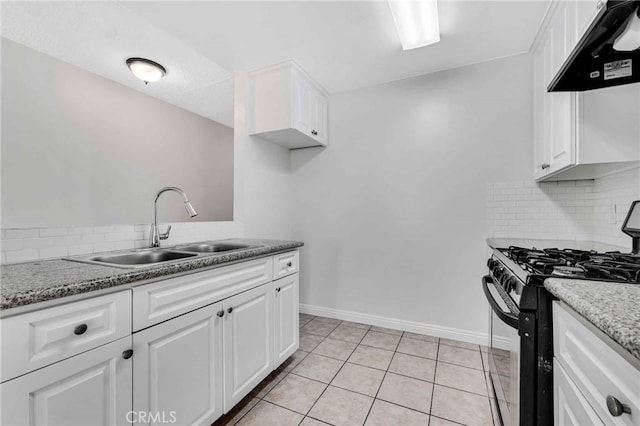 kitchen featuring tasteful backsplash, sink, stainless steel gas range oven, white cabinets, and extractor fan