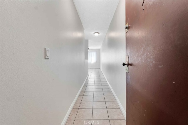 hallway with light tile patterned floors