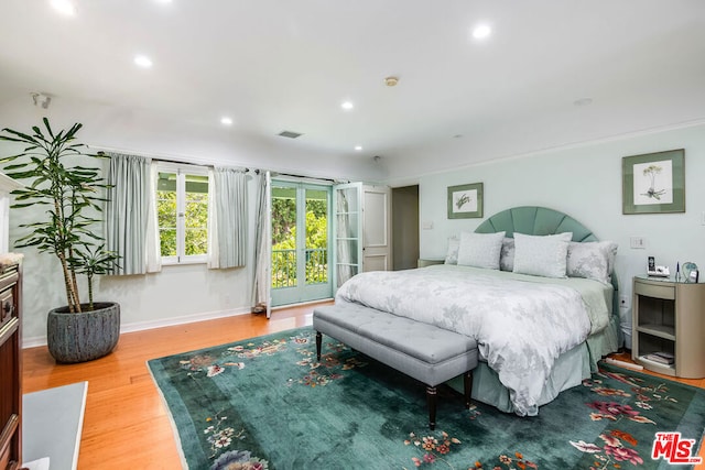 bedroom featuring wood-type flooring