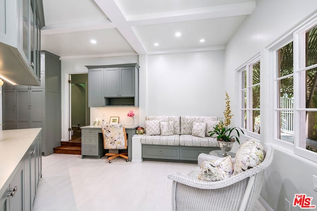 living room featuring light hardwood / wood-style floors, beamed ceiling, and coffered ceiling