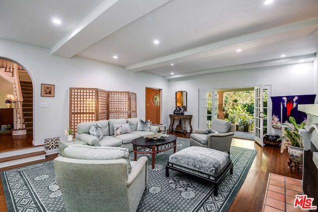 living room with dark wood-type flooring and beam ceiling