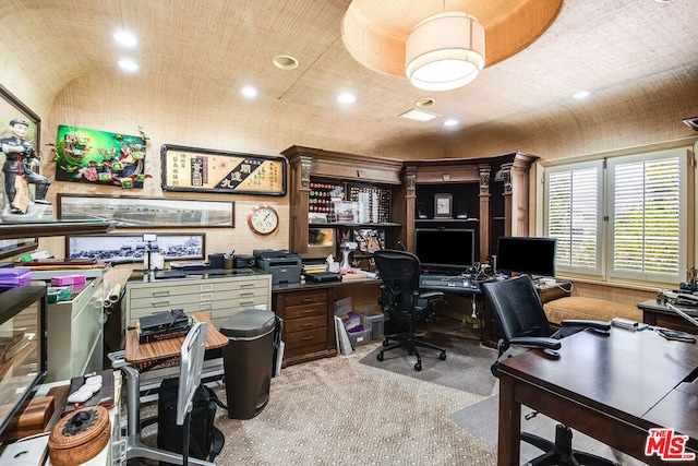 carpeted home office featuring lofted ceiling