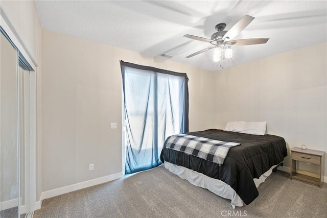 bedroom featuring ceiling fan and light carpet