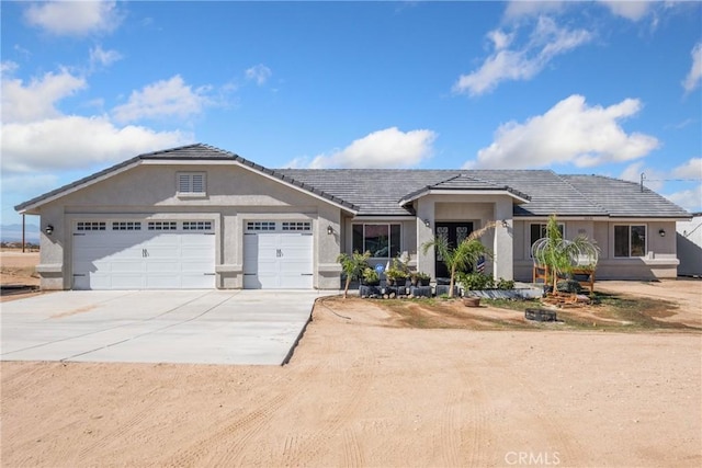 ranch-style home featuring a garage