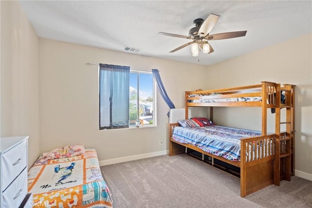 bedroom with light carpet and ceiling fan