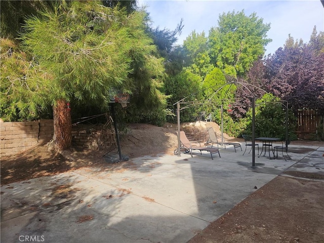 view of home's community with a patio area