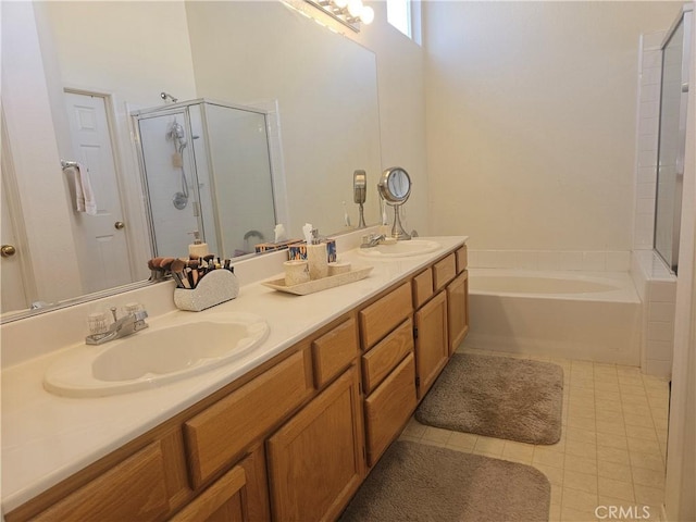 bathroom featuring vanity and shower with separate bathtub