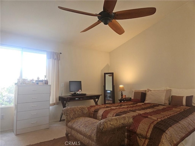 carpeted bedroom with vaulted ceiling, multiple windows, and ceiling fan