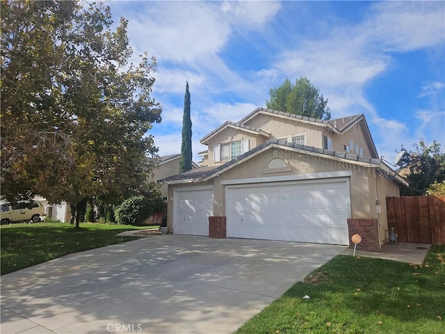 view of front of home with a front lawn and a garage