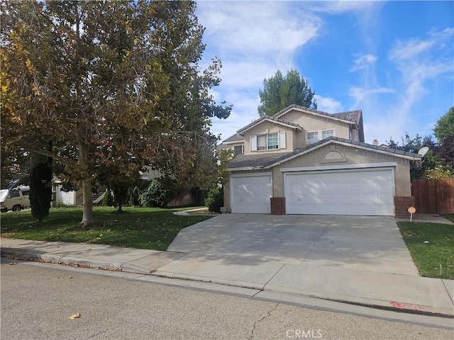 view of front of home featuring a front lawn and a garage