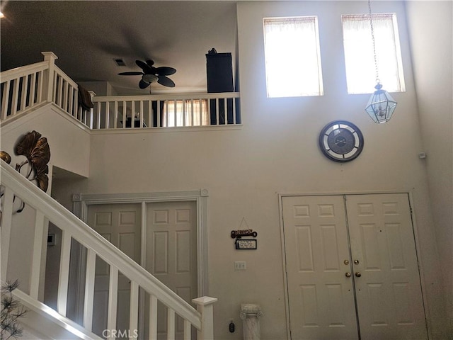 entryway featuring ceiling fan