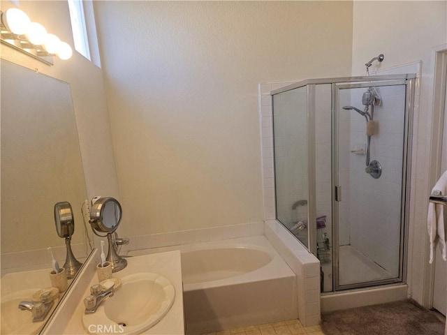 bathroom featuring separate shower and tub and sink