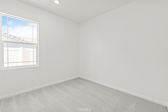 unfurnished room featuring carpet