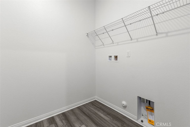 washroom featuring hookup for a washing machine, dark hardwood / wood-style floors, and gas dryer hookup