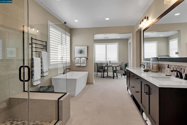 bathroom featuring vanity, plus walk in shower, and tile patterned floors