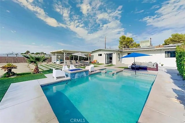 view of pool with an in ground hot tub and a patio