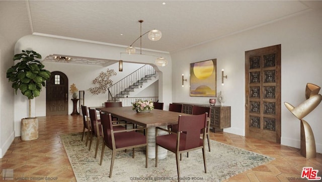 dining area featuring crown molding