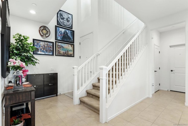 stairway featuring tile patterned floors