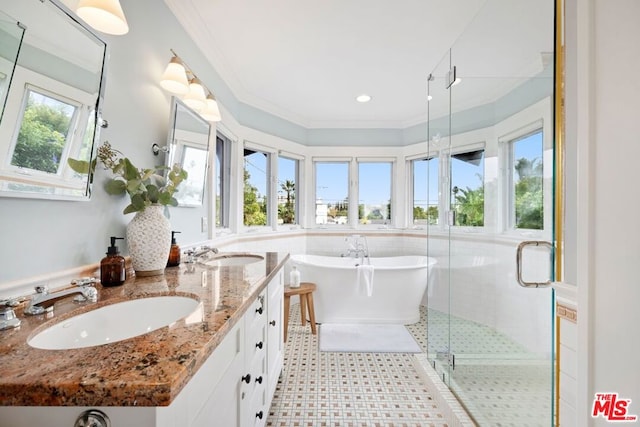 bathroom with plus walk in shower, crown molding, and a wealth of natural light