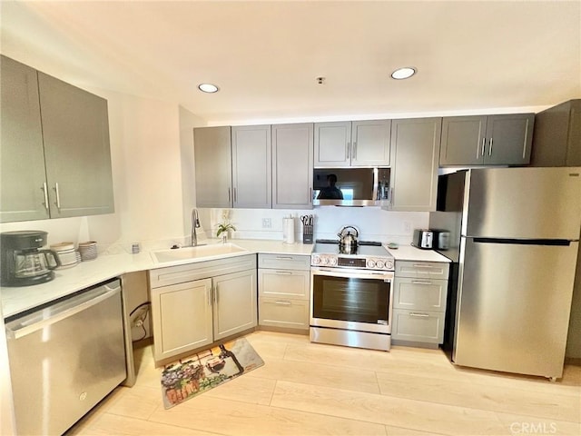 36 Camino De Flores Unit 69, Avalon, CA 90704 - kitchen featuring stainless steel appliances, a sink, light countertops, recessed lighting, and gray cabinets