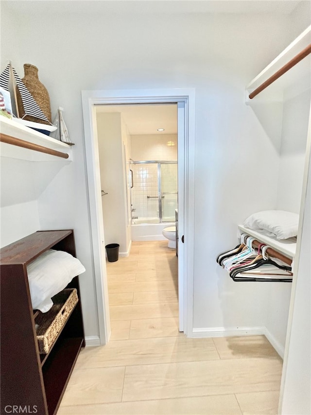 spacious closet with light hardwood / wood-style floors