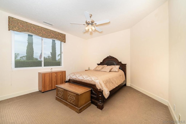 bedroom featuring light colored carpet and ceiling fan