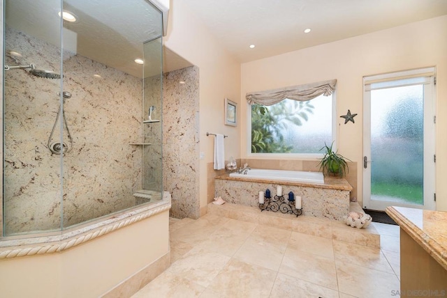 bathroom featuring vanity and separate shower and tub