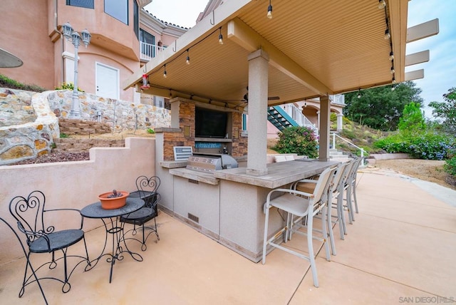 view of patio / terrace with grilling area, area for grilling, and an outdoor bar