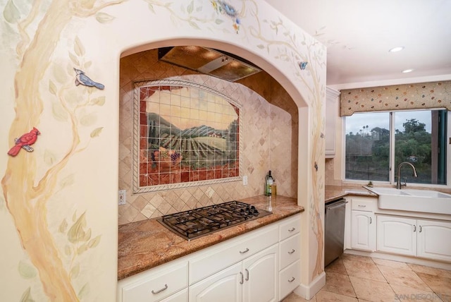 kitchen featuring backsplash, white cabinetry, stainless steel dishwasher, gas cooktop, and sink