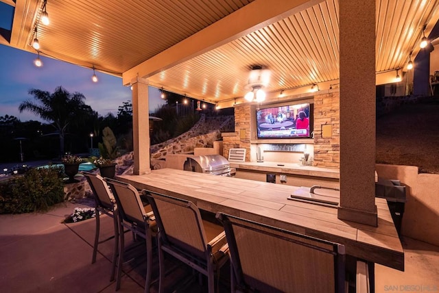 view of patio / terrace with area for grilling and an outdoor kitchen