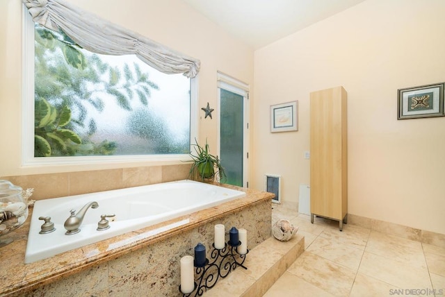 bathroom featuring tiled bath