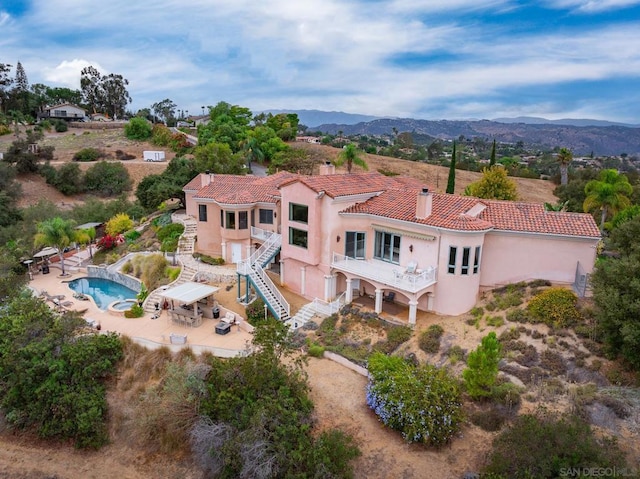 birds eye view of property with a mountain view