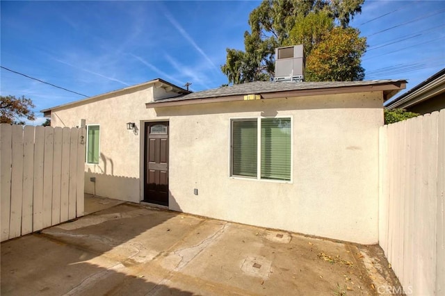 rear view of property featuring a patio