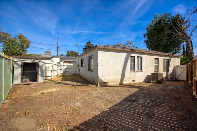 view of home's exterior featuring a storage unit and central air condition unit