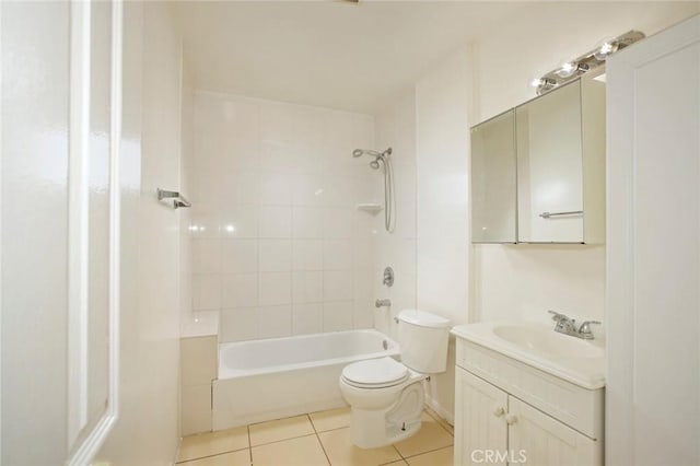 full bathroom with tiled shower / bath, tile patterned floors, toilet, and vanity