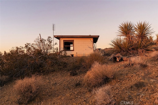 view of property exterior at dusk